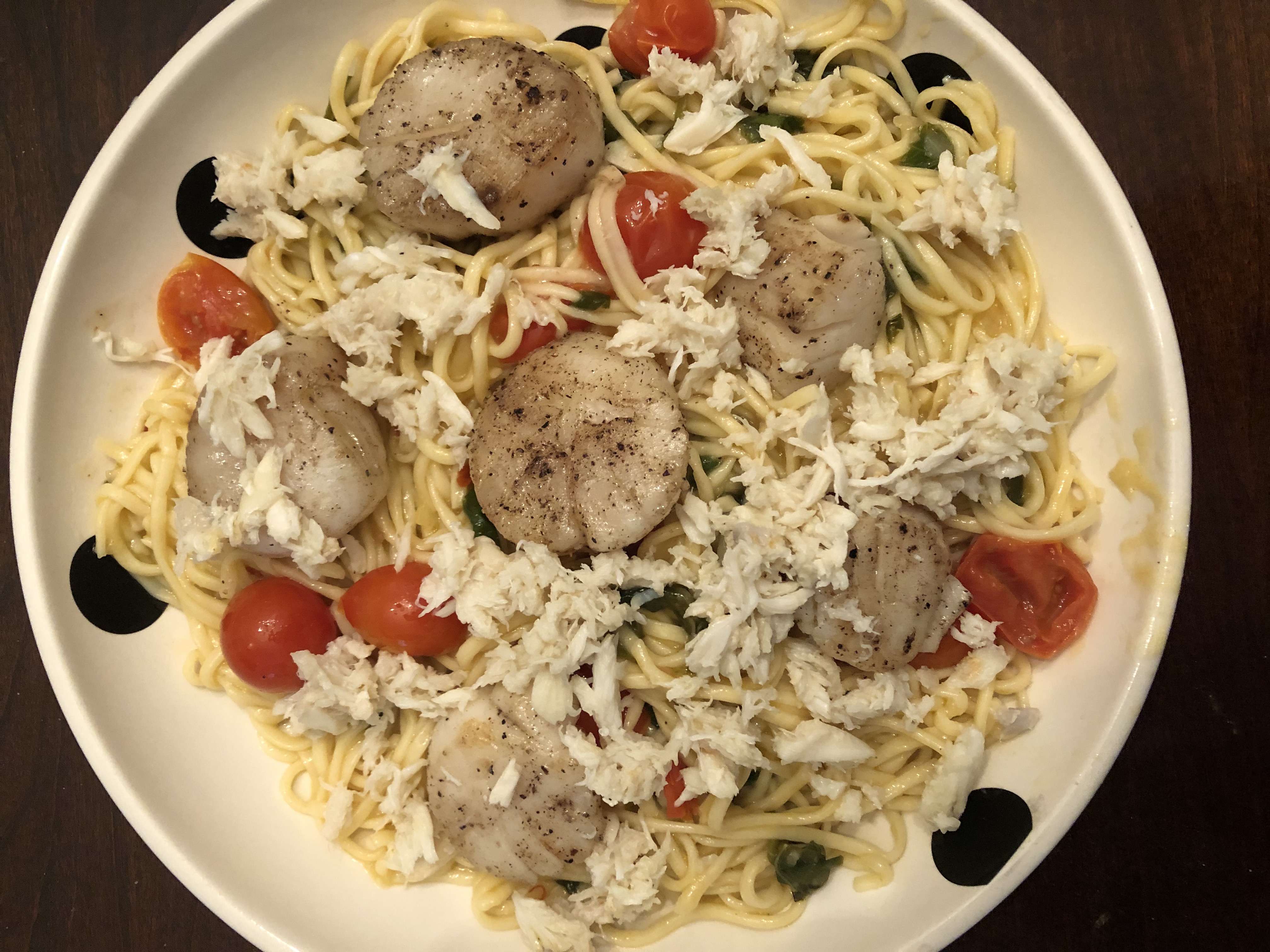 Scallops & Crab Over Pasta in a Spinach, Tomato and White Wine Sauce